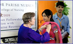 Nurse Gets Pin as Award 