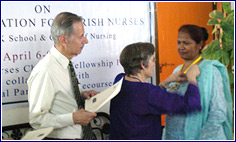 Nurse Gets Pin as Award 