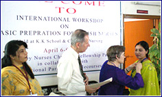 Nurse Gets Pin as Award 